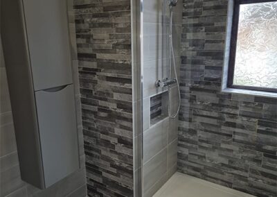 Gorgeous Grey Bathroom with Porcelain Feature Tile within Shower